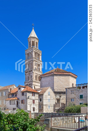 Cathedral of Saint Domnius view from back alley in Split, Croatia. Tall historic belfry under bright sunny sky Cathedral of Saint Domnius view from back alley in Split, Croatia. Tall historic belfry under bright sunny sky 142363535