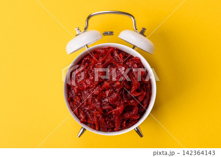 Grated beetroot with salt and spices as an ingredient for borscht or a vegan salad. Grated beetroot 142364143