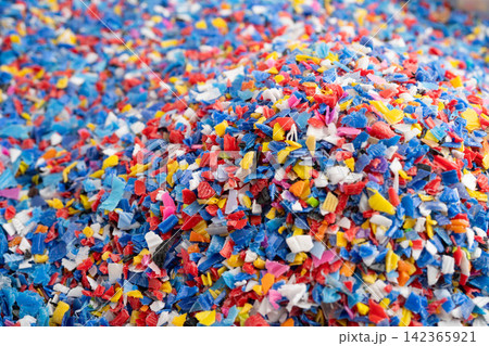 Plastic colorful pieces recycling shredded for industrial use. 142365921