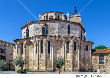 Apse of Basilica of St. Paul in Narbonne, France, exterior view. Mixed Romanesque and Gothic architecture under blue sky Apse of Basilica of St. Paul in Narbonne, France, exterior view. Mixed Romanesque and Gothic architecture under blue sky 142366059