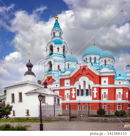 Transfiguration Cathedral and small white church on Valaam, Russia side view. Square crop, stone monastery architecture Transfiguration Cathedral and small white church on Valaam, Russia side view. Square crop, stone monastery architecture 142366115
