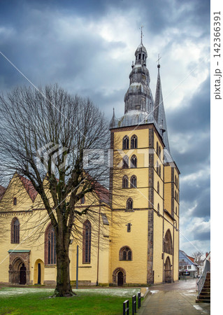 Side view of St Nicholas church in Lemgo, Germany. Winter afternoon cloudy overcast sky 142366391