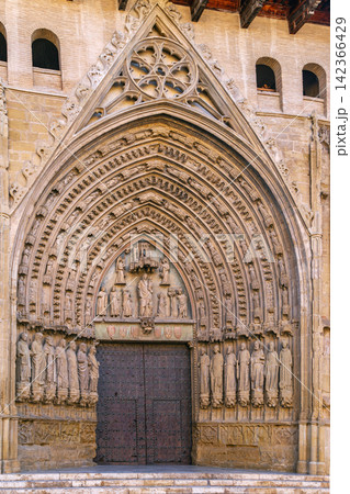 Main portal of Huesca Cathedral, Aragon, Spain, close up view. Sunny daylight, historic Gothic architecture style Main portal of Huesca Cathedral, Aragon, Spain, close up view. Sunny daylight, historic Gothic architecture style 142366429