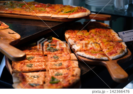 home made ellipse pan pizza on served home made ellipse pan pizza on served 142366476