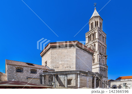 Saint Domnius Cathedral in Split Croatia low angle view. Romanesque bell tower under clear sky Saint Domnius Cathedral in Split Croatia low angle view. Romanesque bell tower under clear sky 142366596