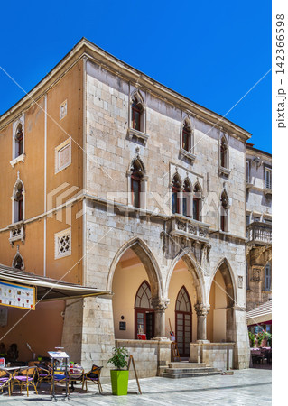 Old Town Hall facade in Split Croatia front view. Gothic architecture loggia under sunny sky Old Town Hall facade in Split Croatia front view. Gothic architecture loggia under sunny sky 142366598