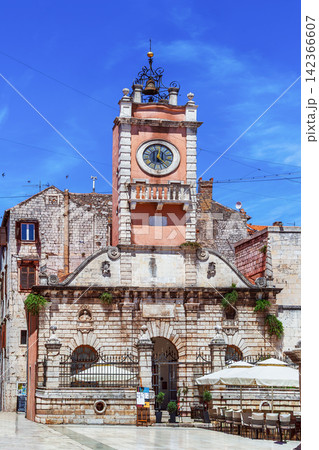 City Guard with clock tower in Zadar Croatia front view. Renaissance architecture under blue sky City Guard with clock tower in Zadar Croatia front view. Renaissance architecture under blue sky 142366607