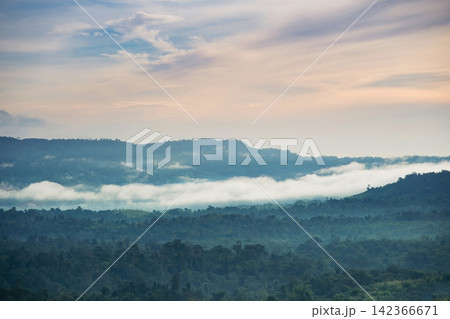 morning mist cover the forest villages between mountains with cloudy orange sunrise sky morning mist cover the forest villages between mountains with cloudy orange sunrise sky 142366671