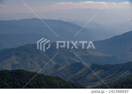 mountain hills and valley in sunny clear blue sky with flowing white cloud in morning sunshine mountain hills and valley in sunny clear blue sky with flowing white cloud in morning sunshine 142366697