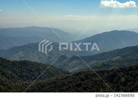 mountain hills and valley in sunny clear blue sky with flowing white cloud in morning sunshine mountain hills and valley in sunny clear blue sky with flowing white cloud in morning sunshine 142366698