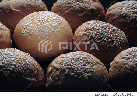 one perfect freshness sesame topping bun in spotlight among others berger breads on oven tray present about concept of picking up a chosen perfect one one perfect freshness sesame topping bun in spotlight among others berger breads on oven tray present about concept of picking up a chosen perfect one 142366940