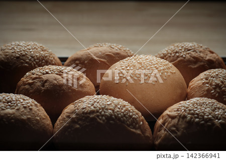 one perfect freshness sesame topping bun in spotlight among others berger breads on oven tray represent about concept of picking up a chosen perfect one one perfect freshness sesame topping bun in spotlight among others berger breads on oven tray represent about concept of picking up a chosen perfect one 142366941