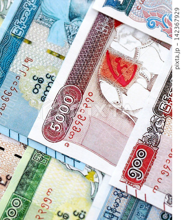 Myanmar kyat paper banknotes pile on table. Myanmar MMK currency money bills in big amount 142367929