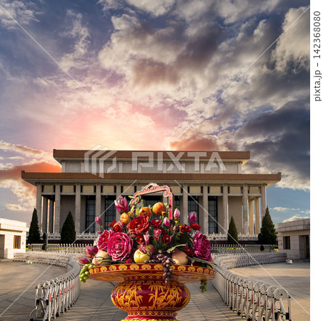 Mausoleum of Mao Zedong and huge flower basket (against the sunset), Tiananmen Square, Beijing, China Mausoleum of Mao Zedong and huge flower basket (against the sunset), Tiananmen Square, Beijing, China 142368080