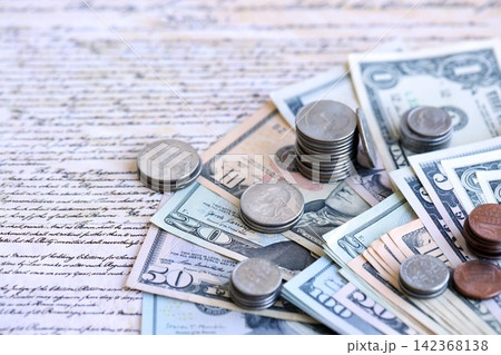 National Debt Ceiling Concept - US Constitution with different banknotes of Dollar Bills National Debt Ceiling Concept - US Constitution with different banknotes of Dollar Bills 142368138