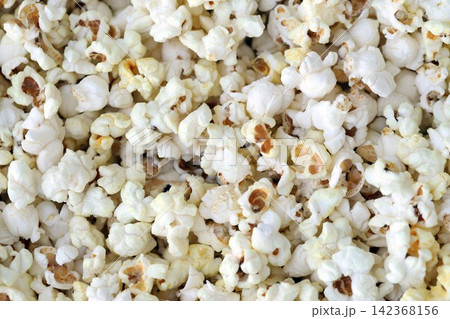Large group of fresh cooked popcorn displayed for sale at a street food market Large group of fresh cooked popcorn displayed for sale at a street food market 142368156