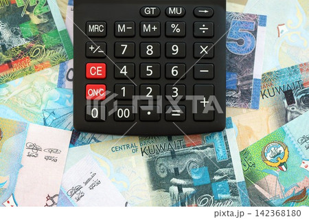 Kuwaiti dinar currency money bills and calculator. The concept of taxation and money count 142368180