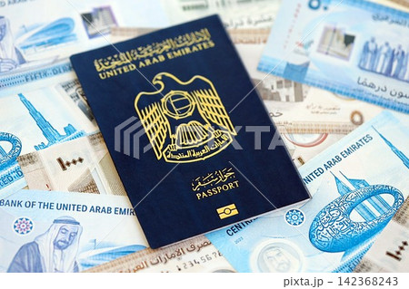 United Arab Emirates dirham currency money bills and passport. The concept of travel and vacation United Arab Emirates dirham currency money bills and passport. The concept of travel and vacation 142368243