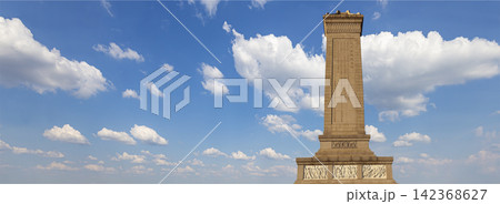 Monument to the People's Heroes at the Tiananmen Square (against the sky with clouds), Beijing, China. Translation of the inscription on the monument: Eternal glory to the people's heroes... 142368627
