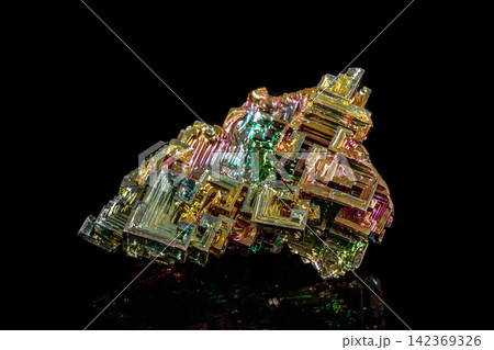 Macro of the stone bismuth mineral on a black background Macro of the stone bismuth mineral on a black background 142369326