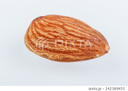 macro almond nuts on a white background macro almond nuts on a white background 142369453