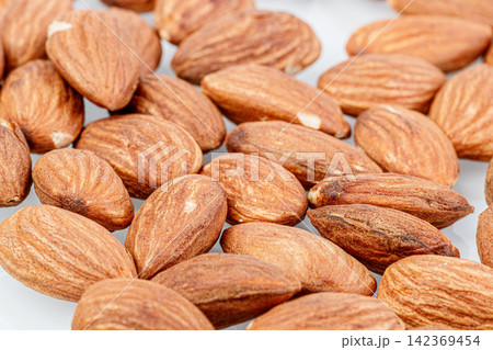 macro almond nuts on a white background macro almond nuts on a white background 142369454