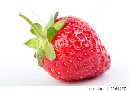 beautiful and ripe red strawberries on a white background beautiful and ripe red strawberries on a white background 142369477