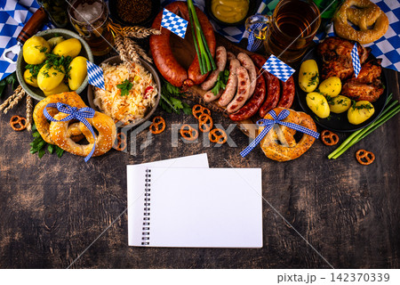 Oktoberfest food: beer, pretzel, sausages, stewed cabbage, potato 142370339