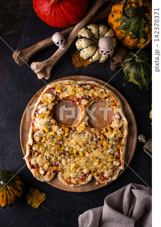Halloween scary pizza in shape of ghost 142370371