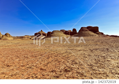 Desert Landscape with Sandstone Rock Formations and Blue Sky 142372019