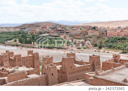 Moroccan Kasbah Desert Village Panorama with Atlas Mountain Landscape Moroccan Kasbah Desert Village Panorama with Atlas Mountain Landscape 142372081