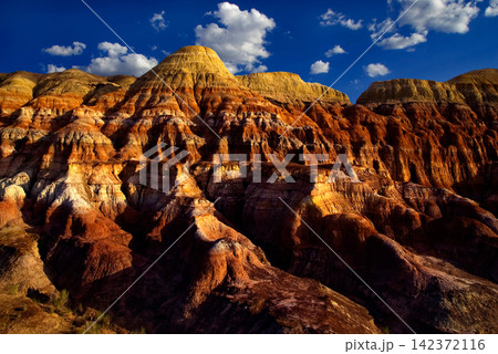 Colorful Badlands Desert Landscape with Eroded Sandstone Cliffs Colorful Badlands Desert Landscape with Eroded Sandstone Cliffs 142372116