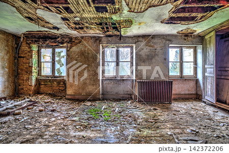 Abandoned Building Interior with Decayed Ceiling and Broken Windows Abandoned Building Interior with Decayed Ceiling and Broken Windows 142372206