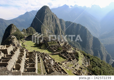 Machu Picchu Inca Ruins in Andes Mountain Landscape Machu Picchu Inca Ruins in Andes Mountain Landscape 142372239