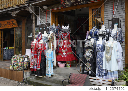 Shop with national Chinese women's dresses of the Miao tribe in Fenghuang, China Shop with national Chinese women's dresses of the Miao tribe in Fenghuang, China 142374302