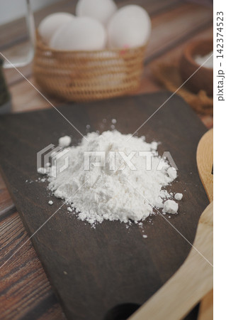 Baking ingredients on a wooden table with eggs Baking ingredients on a wooden table with eggs 142374523