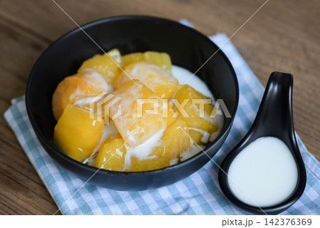 cassava food on the table food, sweet dessert made of boiled cassava, sugar and coconut milik - Thai food cassava food on the table food, sweet dessert made of boiled cassava, sugar and coconut milik - Thai food 142376369