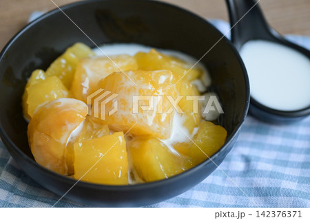 cassava food on the table food, sweet dessert made of boiled cassava, sugar and coconut milik - Thai food cassava food on the table food, sweet dessert made of boiled cassava, sugar and coconut milik - Thai food 142376371