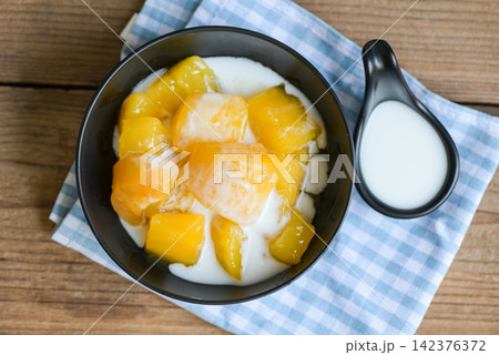 cassava food on the table food, sweet dessert made of boiled cassava, sugar and coconut milik - Thai food 142376372