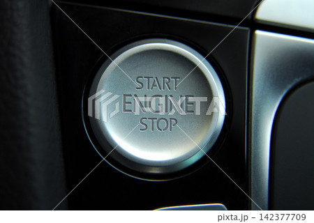 Car Engine Start Stop Button in Modern Dashboard Close-Up Car Engine Start Stop Button in Modern Dashboard Close-Up 142377709