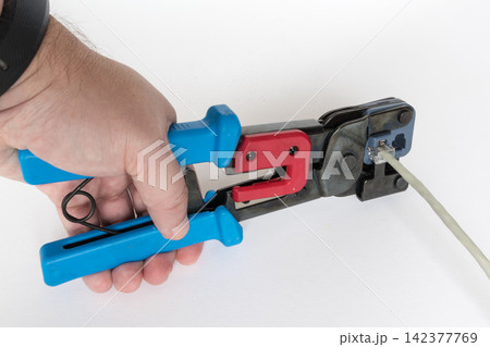 Ethernet Cable Crimping Tool on White Background 142377769