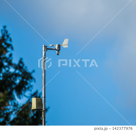 Weather Station Wind Sensor on Mast Against Blue Sky 142377976
