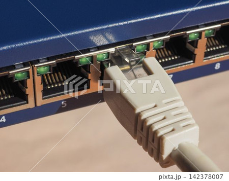 Ethernet Cable Connected to Network Switch Ports Ethernet Cable Connected to Network Switch Ports 142378007