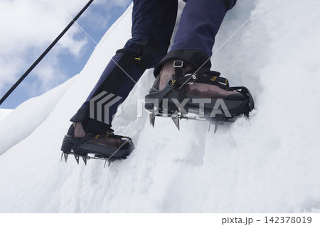 Mountaineering Crampons on Snowy Alpine Ice Climb Mountaineering Crampons on Snowy Alpine Ice Climb 142378019
