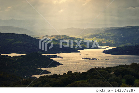 Mountain Lake Landscape with Dramatic Golden Light Mountain Lake Landscape with Dramatic Golden Light 142378297