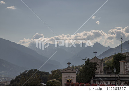 Italian alps cemetery with chapels and mountain landscape 142385227