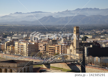 Tortosa city panorama with bell tower and ebro river bridge Tortosa city panorama with bell tower and ebro river bridge 142385291