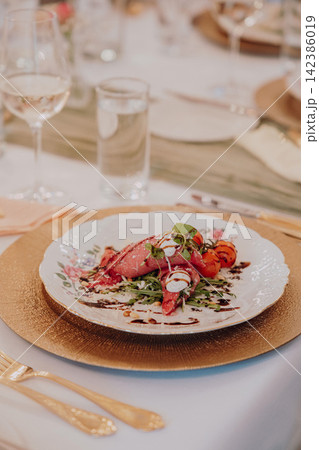 Gourmet dining experience with exquisite dish presentation. Fine wedding dining and culinary art. Gourmet dining experience with exquisite dish presentation. Fine wedding dining and culinary art. 142386019