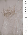 Wedding Dress Details Close-Up, Elegant Bridal Gown Fabric and Delicate Embellishments, Romantic Wedding Fashion and Bridal Preparation 142386065