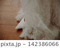 Wedding Dress Details Close-Up, Elegant Bridal Gown Fabric and Delicate Embellishments, Romantic Wedding Fashion and Bridal Preparation 142386066